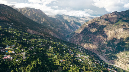 Fototapeta na wymiar panoramic aerial landscape of Himalayan Mountains at sunset in village of Kalpa in Himachal Pradesh India