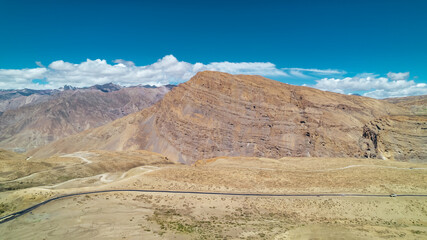 large mountain canyons in Himalayas of Spiti Valley in North India during sunny summer day, aerial