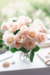 Bouquet of roses on the windowsill in the interior of the bedroom.
