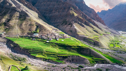 Aerial of Mud Village homes in the Mountains of Pin Valley in Himachal Pradesh with lush green...