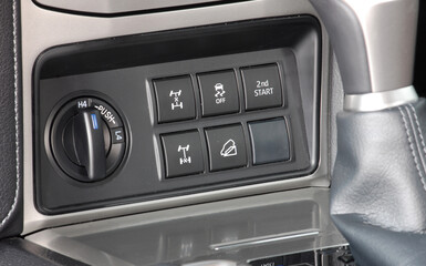 Menu choice and all Terrain Select switch in an SUV