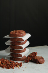 Pile of Chocolate Cookies on dark black background on a table.