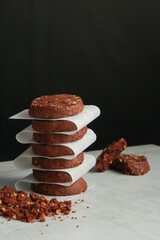 Pile of Chocolate Cookies on dark black background on a table.