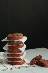 Pile of Chocolate Cookies on dark black background on a table.