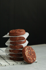 Pile of Chocolate Cookies on dark black background on a table.