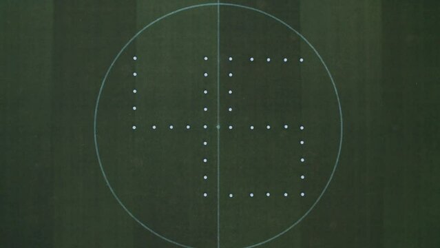The figure 45 is laid out of footballs on the lawn of a football stadium