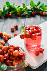 Cherries drink with fresh cherry, Cherry juice, on wood background, red drink