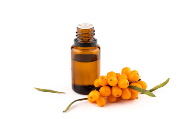 Sea-buckthorn oil and berries on a white background.