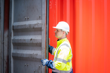 Professional container yard workers checking stock for loading in the container yard warehouse,Container yard warehouse inspection,Cargo Shipping Import and Export industry.