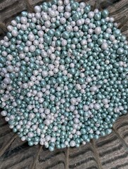 White and blue beads on a heap