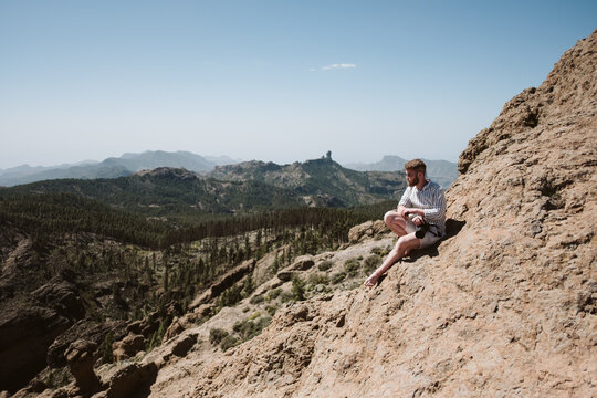 Photographer taking photos in a mountainous landscape