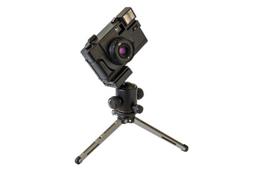 Fototapeta na wymiar Retro film camera on mini tripod