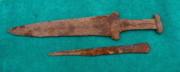 akinak - Scythian sword, Scythian dagger of the early Iron Age 3-5 centuries BC on a green cloth
