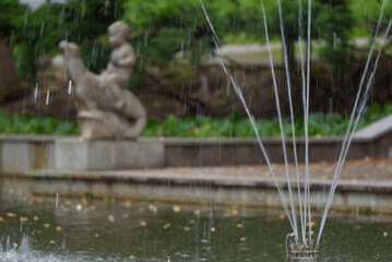 THE SPA TOWN PARK - A fountain and a statue on walking paths
