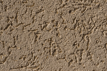 Clean roughcast in yellow on the house wall     