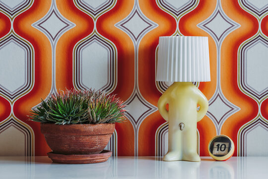 Lamp ball with number and plant on table