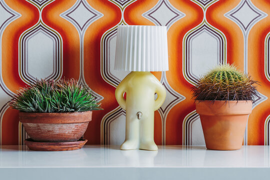 Lamp ball with number and plant on table