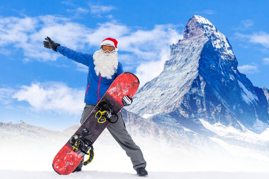 Santa Claus on a snowboard. Man in a red suit Santa Claus with a white beard in a ski mask jumped on a snowboard. The ski slope