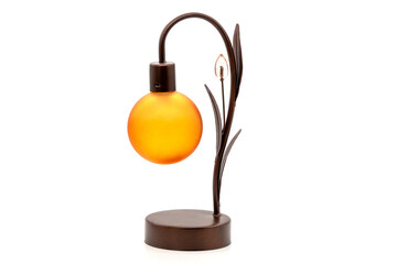 Small lamp glowing in bedroom night stand, dim room