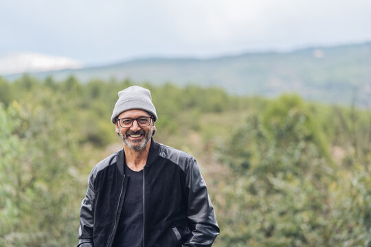 Portrait of a middle-aged man with winter hat looking at camera