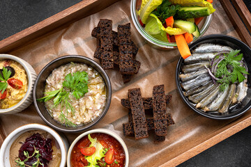 Various appetizers, snacks from vegetables on a wooden board
