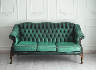 Beautiful antique blue sofa on a light background