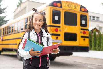 First day of school. Happy child girl elementary school student runs to class. concept back to school.