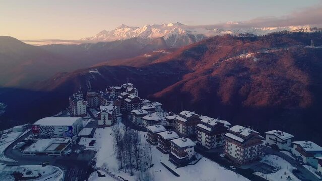 Sunrize, morning aerial view of the Olympic mountain village Roza Plato