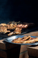 Stainless steel tray with the meat already roasted