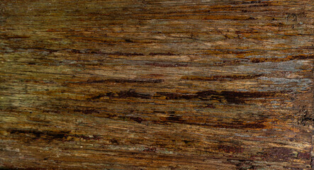 Drewniane tło z desek, ciemne drewno, naturalna tekstura starego drzewa.