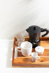 Coffee making equipment isolated on white background. Wooden tray. Brewing coffee, Cup, Mug. Brewing coffee at home. Cafe and restaurant. Drink. Beverage. Morning light.