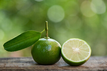 Green Lime fruits on nature background.