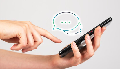 Forefinger swiping positive comments on phone. Consumer, client satisfaction. Good feedback on social media. Woman holding smartphone and reading messages. High quality photo