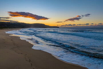 Aerial sunrise at the beach with clouds