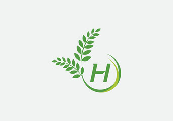 Green leaf and laurel wreath logo design vector with the letter and alphabet H