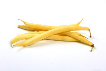 bunch of yellow butter beans on white background