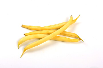 bunch of yellow butter beans on white background