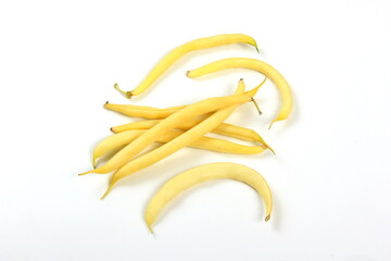 bunch of yellow butter beans on white background