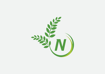 Green leaf and laurel wreath logo design vector with the letter and alphabet N