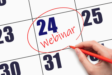 24th day of the month. Hand writing text WEBINAR and circling the calendar date.