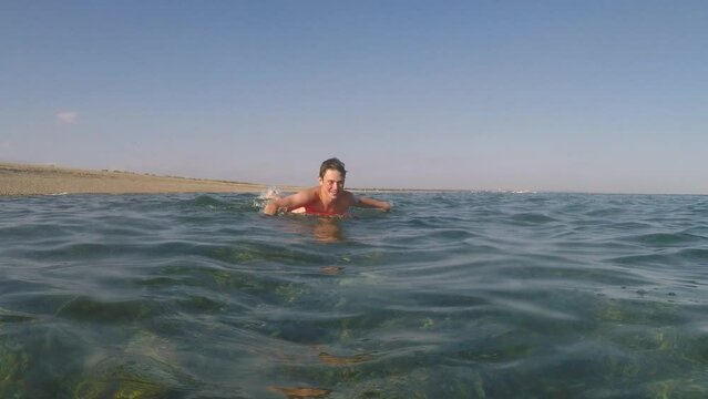 A 17 Year Old Teenage Boy Swimming In The Sea