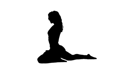 Silhouette of young woman practicing yoga 