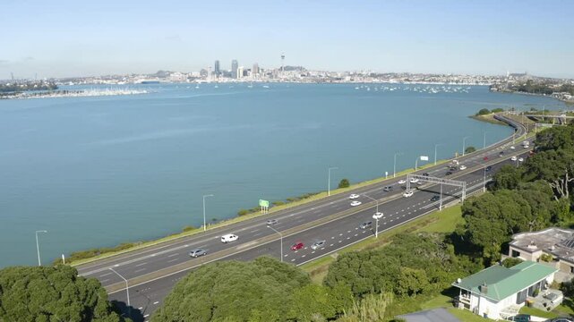 drone view of Auckland Motorway with the city skyline. 