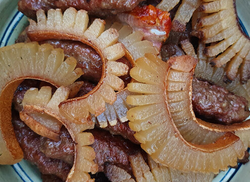 a close-up with traditional Romanian food, grilled meat rolls and roast bacon