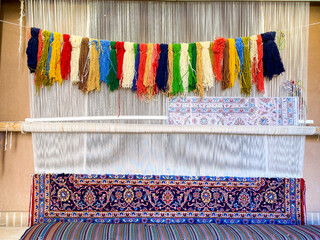 Kashan , Iran - 5th june, 2022: traditional colorful design pattern and various colors threads hang...