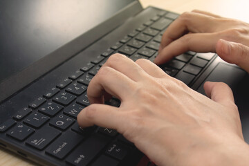 Woman hands  who use laptop typing keyboard Concept and online technology usage