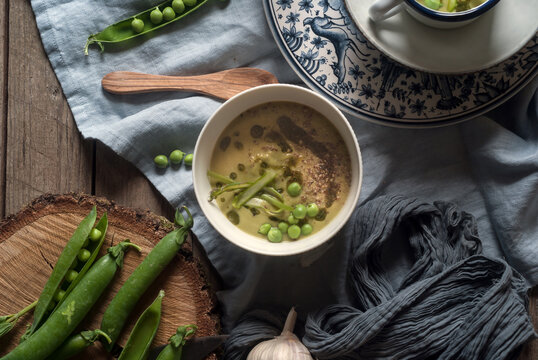 Bowl of creamy coconut soup with pea