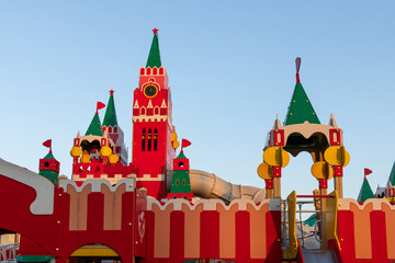 Children's playground in the form of the Moscow Kremlin. Wooden red towers and fortress walls...