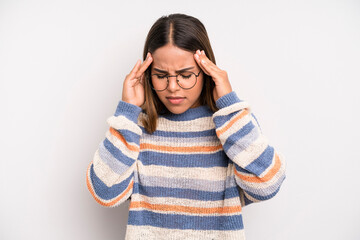 hispanic latin pretty woman looking stressed and frustrated, working under pressure with a headache...