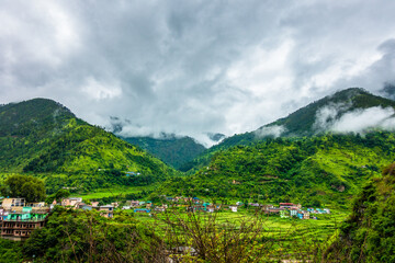 A wide angle shot of a village in the mountains of Lower Himalayan region of Uttarakhand State, India.